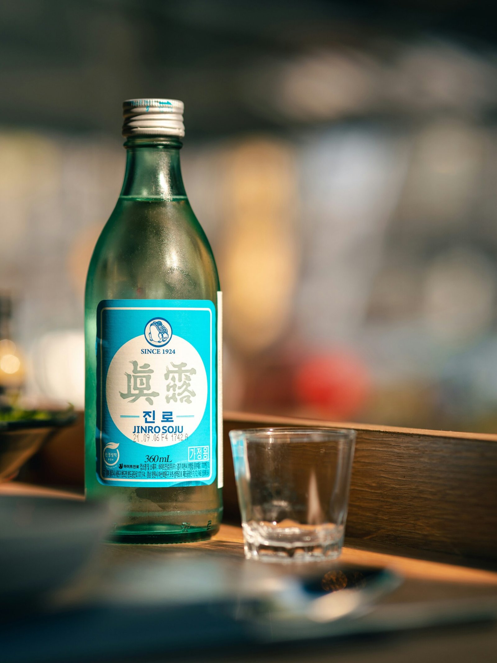 bottle of Jinro soju with a shot glass in Korea