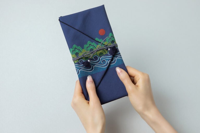 Ilwol Sansu-bo wrapped around a rectangular gift by The Bojagi with Seasons