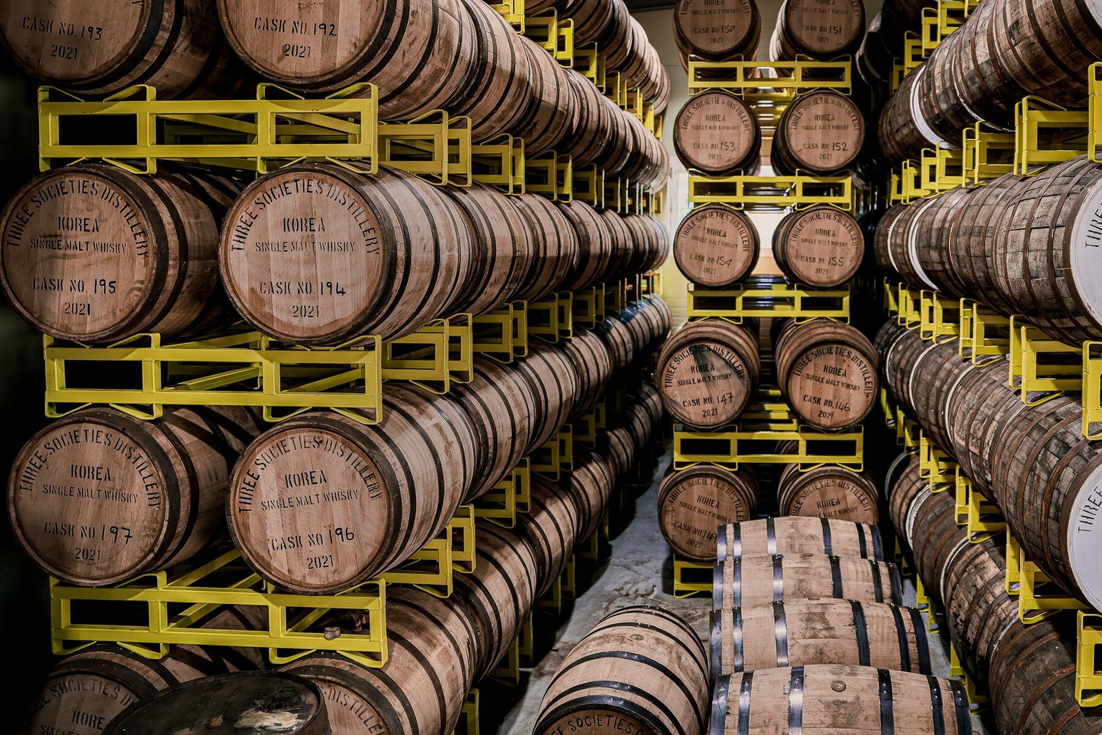Rows of whisky casks aging in Ki One's warehouse in Namyangju, Korea